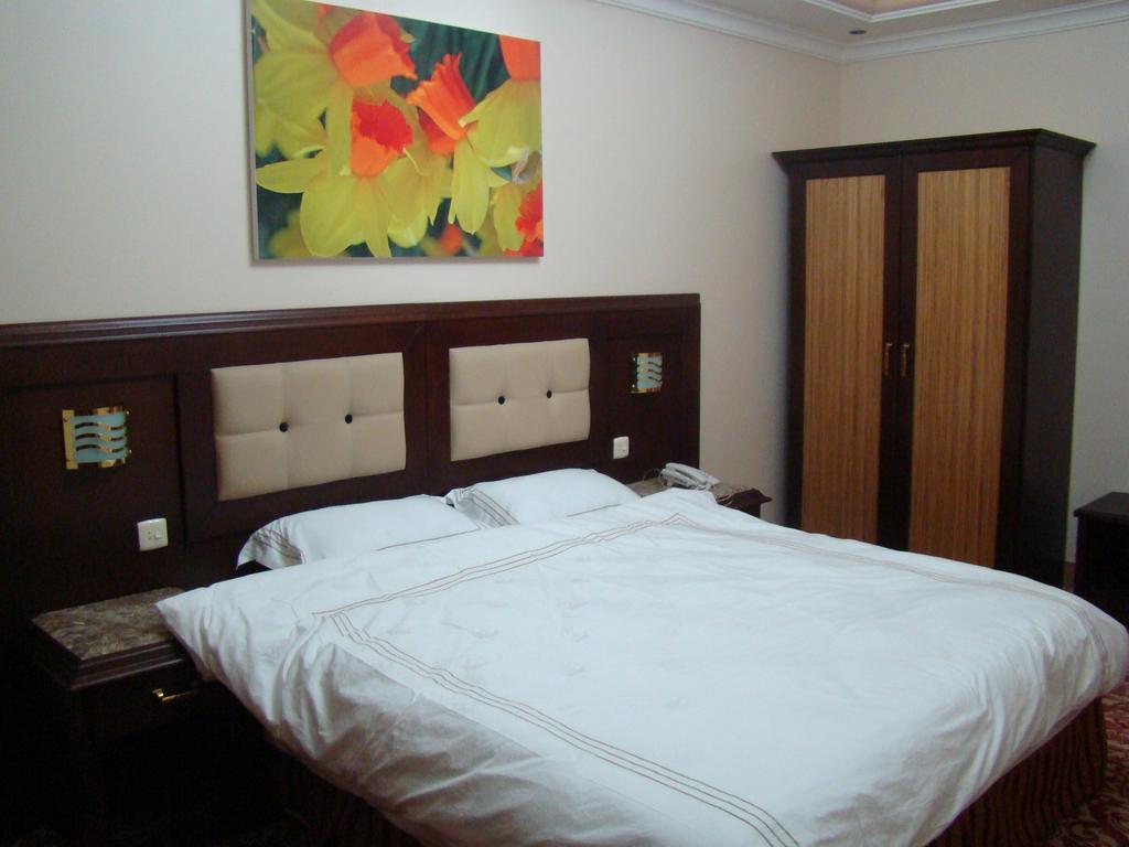 Manazilna Apartments Riad Habitación foto